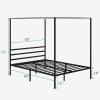 imageYITAHOME Canopy Bed Frame Metal Four Posters 14 Inch Platform with Builtin Headboard Strong Metal Slat Mattress Support No Box Spring Needed Black Queen SizeBlack